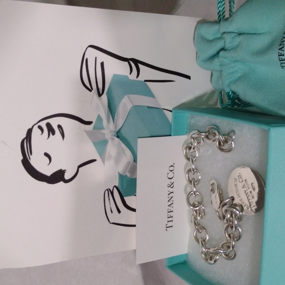 Tiffany Charm Bracelet in Sterling Silver 36.68gms.
